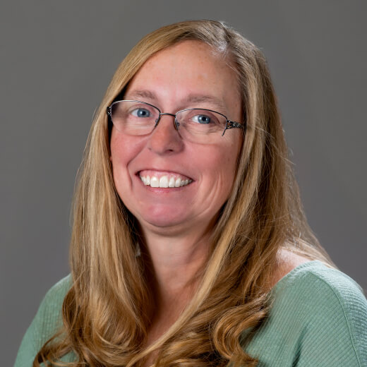 Headshot of team member Angie